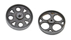 two distinct early 20th century american industrial reinforced cast iron spoked furniture factory cart wheels or casters with uniform black enameled finish