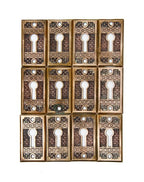 twelve matching antique american c. 1880's "brocade" pattern ornamental cast bronze interior residential keyhole escutcheons