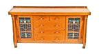 late 1920's american craftsman style interior residential varnished oak wood china cabinet or sideboard with art glass doors