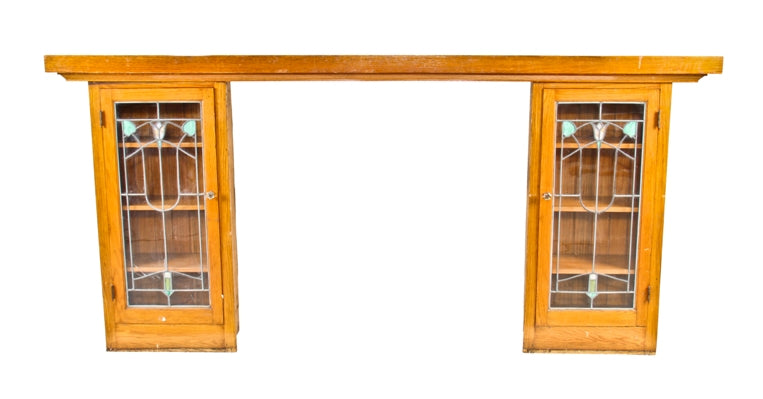 all original late 1920's american craftsman style interior residential bookcase fireplace mantel with leaded art glass cabinet doors