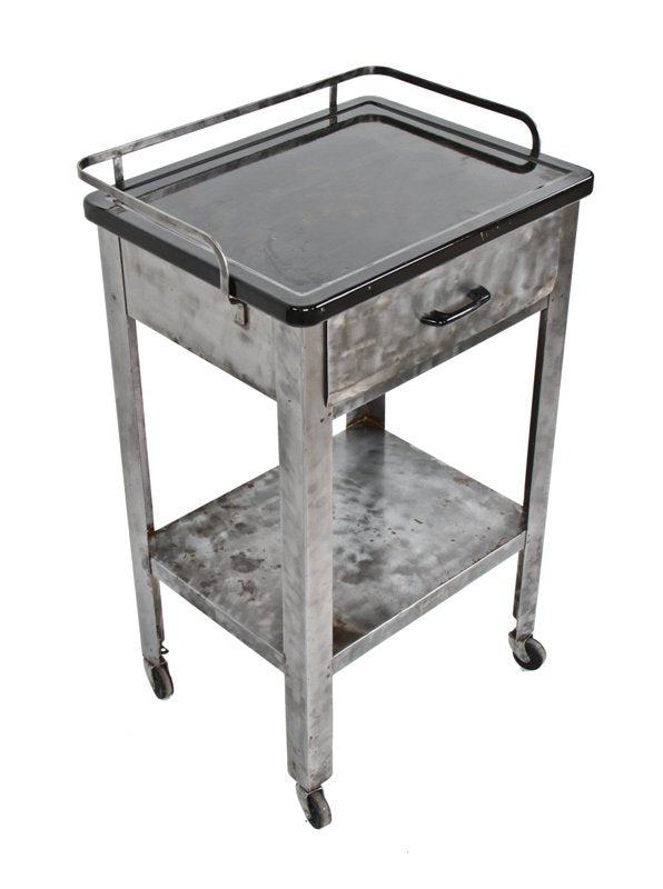 c. 1930's vintage medical four-legged mobile hospital operating room supply cart with black porcelain enameled tabletop
