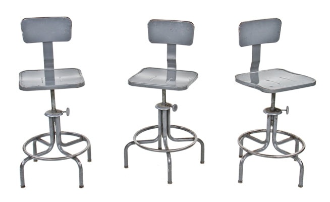 three matching adjustable height vintage american industrial gunship gray enameled factory swivel stools