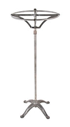 hard to find and highly desirable early 20th century vintage industrial brushed metal revolving garment rack with weighted cast iron base