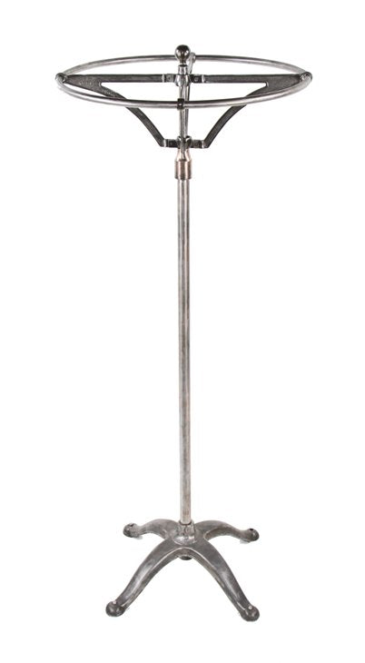 hard to find and highly desirable early 20th century vintage industrial brushed metal revolving garment rack with weighted cast iron base