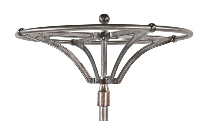 hard to find and highly desirable early 20th century vintage industrial brushed metal revolving garment rack with weighted cast iron base
