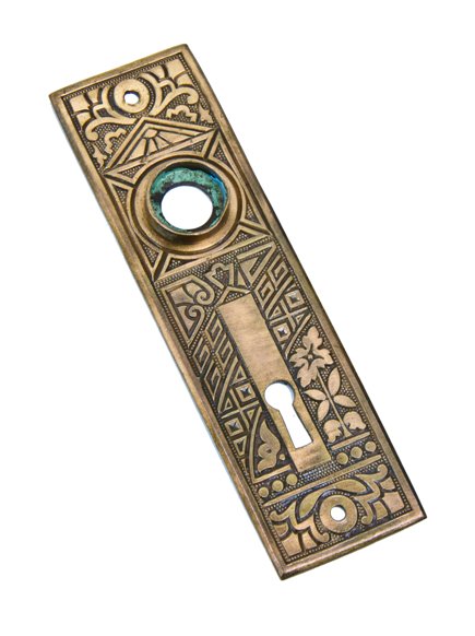 original late 19th century american eastlake style wrought brass "ceylon" pattern residential doorknob backplate with single keyhole