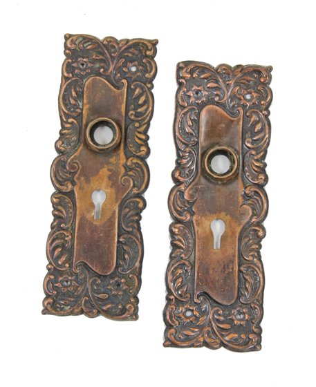matching set of late american victorian era ornamental wrought bronze "eulia" pattern doorknob backplates