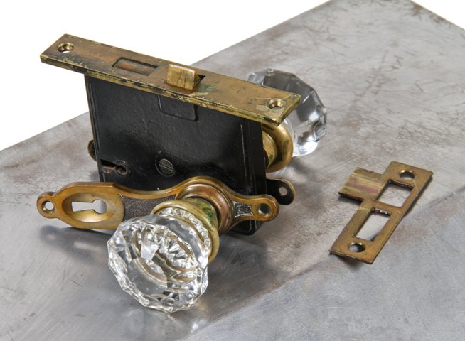 all original c. 1930's interior chicago bungalow residential passage door lockset with pressed glass doorknobs