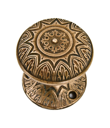early 1880's american ornamental cast bronze "sunburst" pattern banded rim doorknob with matching rosette