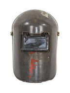 weathered and worn vintage american industrial molded fiberglass welding helmet or mask with hinged eyeshield