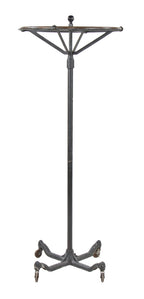 early 20th century american industrial interior clothing store black enameled "dorad" revolving garment rack with weighted cast iron base