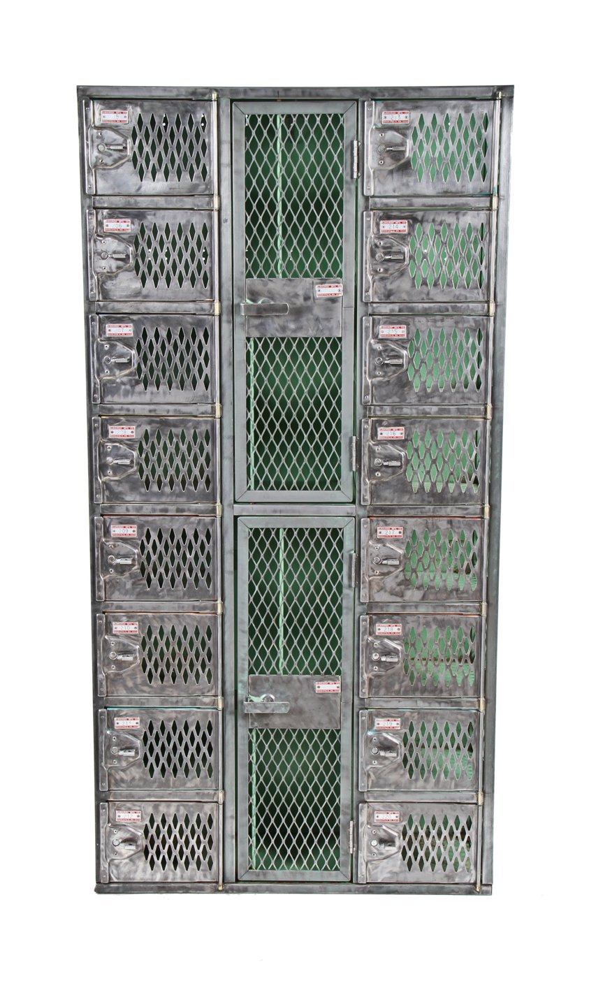 original and intact vintage american industrial freestanding angled iron ventilated compartmentalized locker unit with brushed metal finish