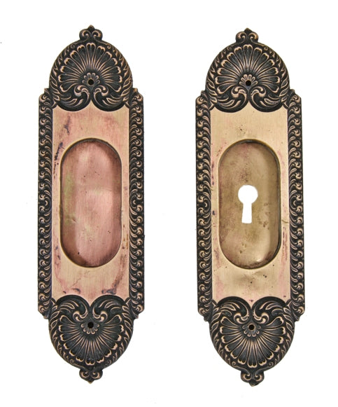 matching pair of original early 20th century ornamental cast brass "stanwich" pattern residential pocket door backplates