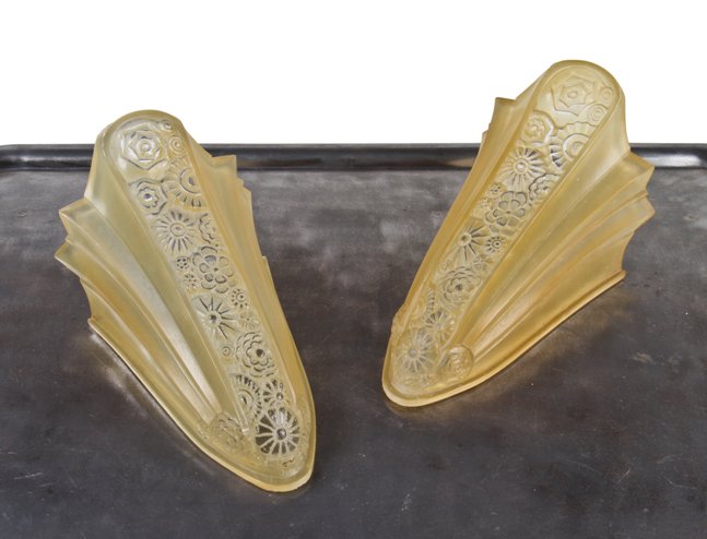 two matching c. 1930's depression era art deco style nauticalesque ornamental pressed glass amber colored  slip shades