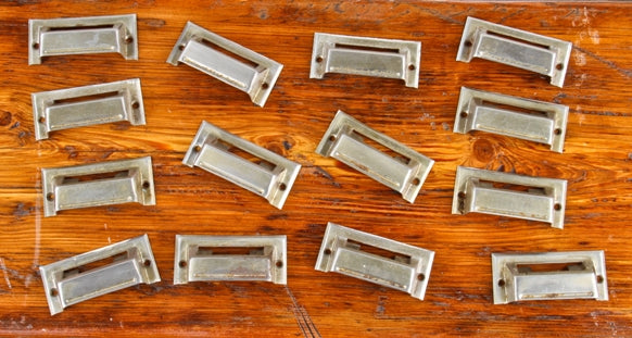 large lot of c. 1920's nickel-plated interior drugstore apothecary cabinet drawer pulls or handles with built-in label holders