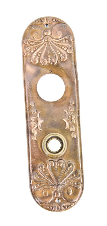 elaborately designed early 20th century american exterior ornamental wrought bronze doorknob backplate with embossed floral motifs