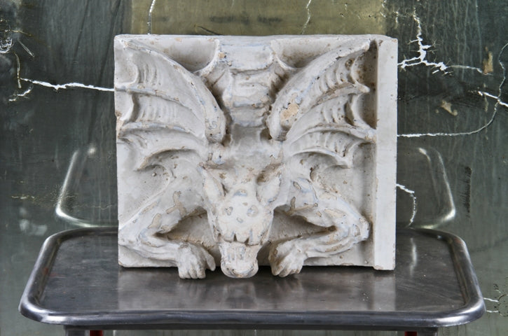 striking c. 1920's american exterior chicago theater building facade white glazed terra cotta panel featuring a spread-winged gargoyle facing downward