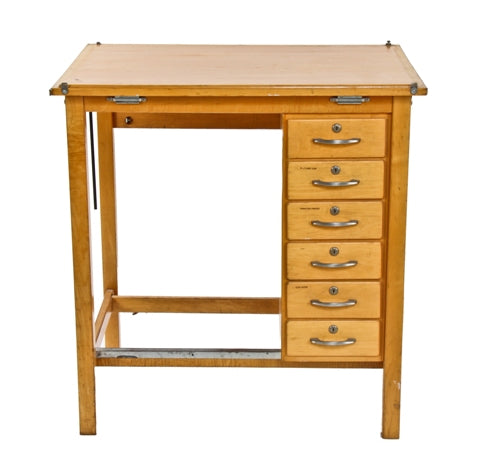 original c. 1950's vintage american industrial varnished maple wood drafting table with a multitude of drawers