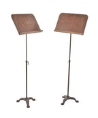 matching set of c. 1930's american theater orchestra pit adjustable height music stands with three-legged cast iron bases