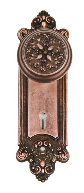 c. 1900's matching residential cast iron "truro" pattern passage door backplate and doorknob with original copper-plated finish largely intact