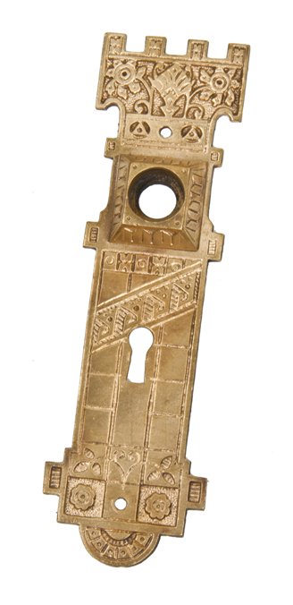 unusual late 19th century american ornamental cast brass residential doorknob backplate with crenellated top