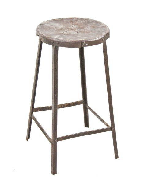 weathered and worn c. 1930's riveted joint heavy gauge angled steel four-legged brand brewery stool with stationary seat