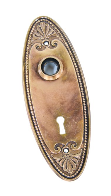 c. 1900's original ornamental stamped bronze metal oval-shaped interior residential doorknob backplate with beaded border