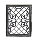 early 20th century interior residential black enameled ornamental cast iron upright baseboard wall register with intricate filigree