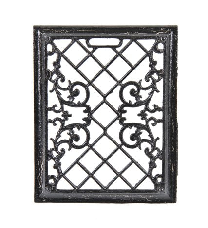 early 20th century interior residential black enameled ornamental cast iron upright baseboard wall register with intricate filigree