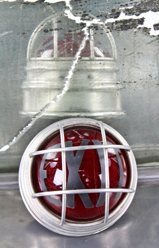 all original c. 1930's american machine age illuminated ruby red exit light with reinforced spun brass metal protective cage