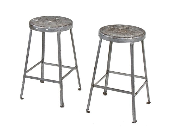 two identical original c. late 1930's vintage industrial heavy gauge angled steel factory shop stools with original paint