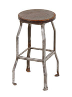 unusual c. 1920's refinished four-legged "otsteel" stationary factory stool with nicely worn circular pine wood seat