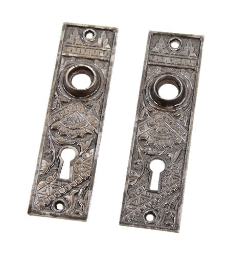 matching set of c. 1880's eastlake style ornamental cast iron "oriental" pattern doorknob backplates with black enameled inlay