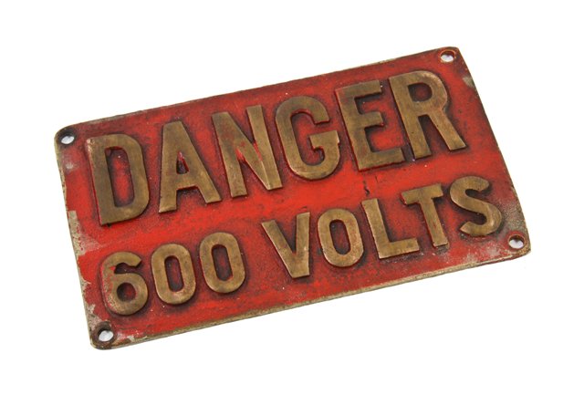 c. 1930's vintage american industrial cast bronze "600 volts" railroad locomotive high voltage warning plaque with red enameled background