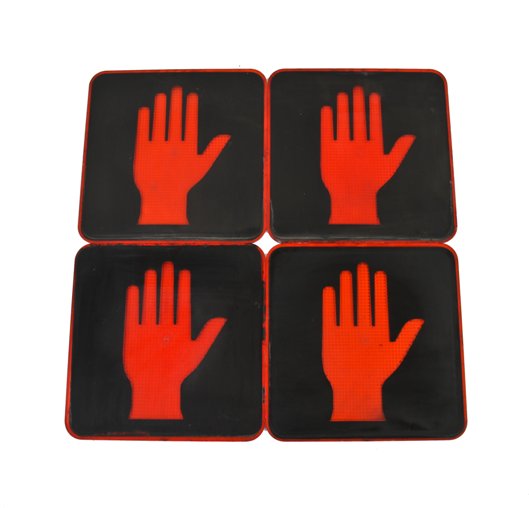 group of four matching american made single-sided chicago city street pictogram "don't walk" pedestrian crossing signal lenses
