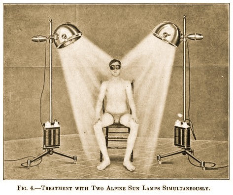 repurposed c. 1920's american medical "light therapy" adjustable height floor lamp with four-legged cast iron mobile base
