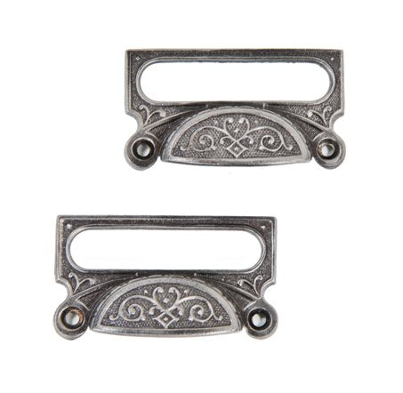 matching set of original c. 1870's ornamental cast iron druggists' cabinet drawer or bin pulls with combined label holders