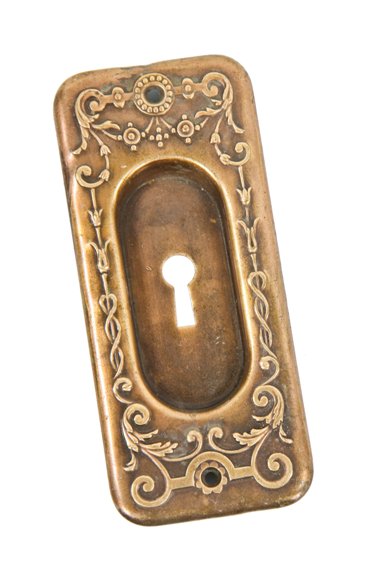 early 20th century american antique embossed brass metal single pocket door escutcheon with recessed cup handle