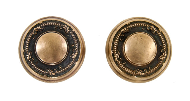 two matching early 20th century heavy cast brass interior residential "gerberoy" pattern passage size antique doorknobs