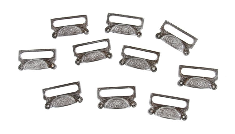 large lot of matching c. 1870's ornamental cast iron druggists' apothecary drawer or bin pulls with elongated label holders
