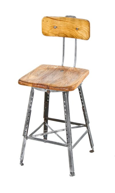 all original heavy duty late 1920's fully adjustable american industrial angled iron stool with maple wood saddle seat and backrest