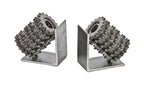 matching set of oversized american industrial repurposed welded joint angled worm gear hob bookends with uniform brushed metal finish