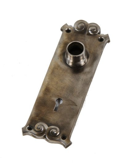 late 19th century american ornamental cast iron reliance building interior passage door backplate with protruding collar or thimble