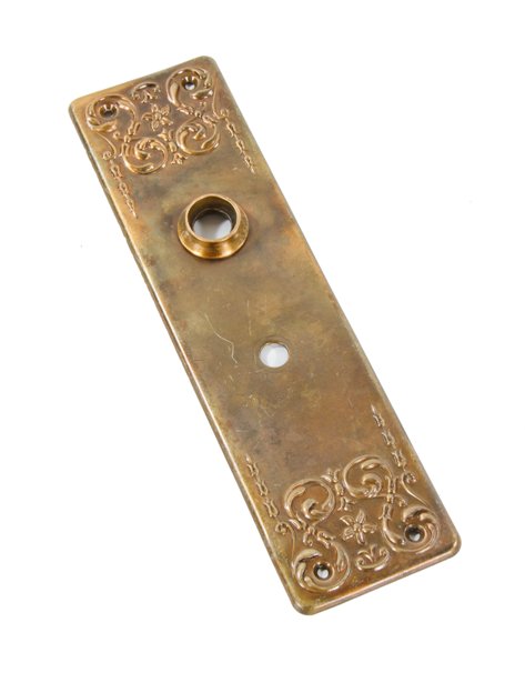 early 20th century antique american stamped ornamental brass metal interior residential doorknob backplate with foliated scrollwork