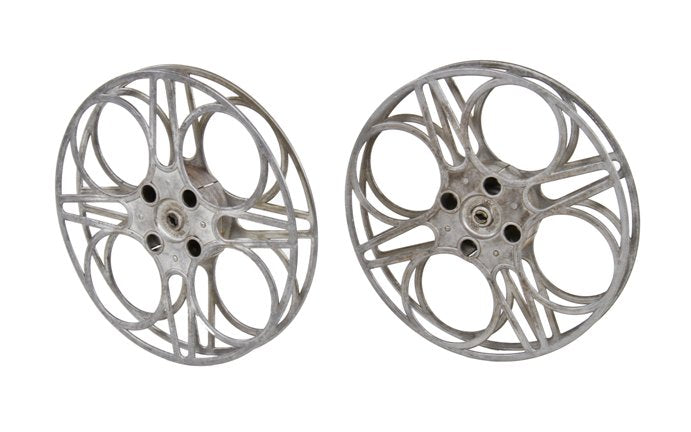 vintage american oversized goldberg brothers cast aluminum filmstrip reel with highly stylized design
