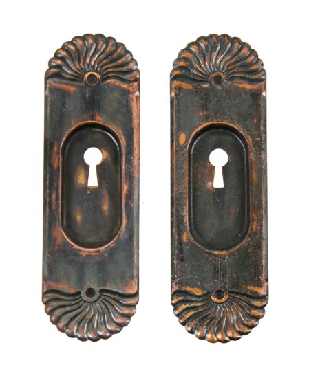 original late 19th century antique american "putnam" pattern stamped brass residential pocket door backplates with oxidized copper finish