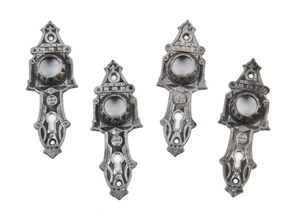 matching lot of uniquely shaped late 19th century ornamental cast iron "screwless spindle" doorknob backplates or escutcheons