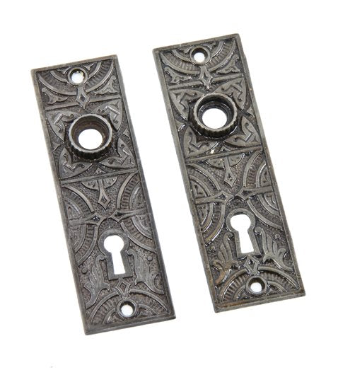 matching pair of original 19th century american antique refinished cast iron passage door escutcheons with fluted thimbles