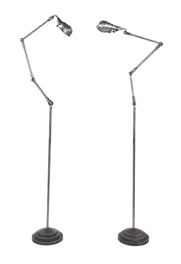 matching pair of all original c. 1940's vintage american industrial articulating arm floor lamps with "stepped" weighted metal bases