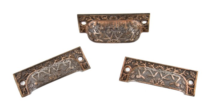 three matching 19th century american eastlake style ornamental copper-plated cast iron "windsor" pattern drawer pulls